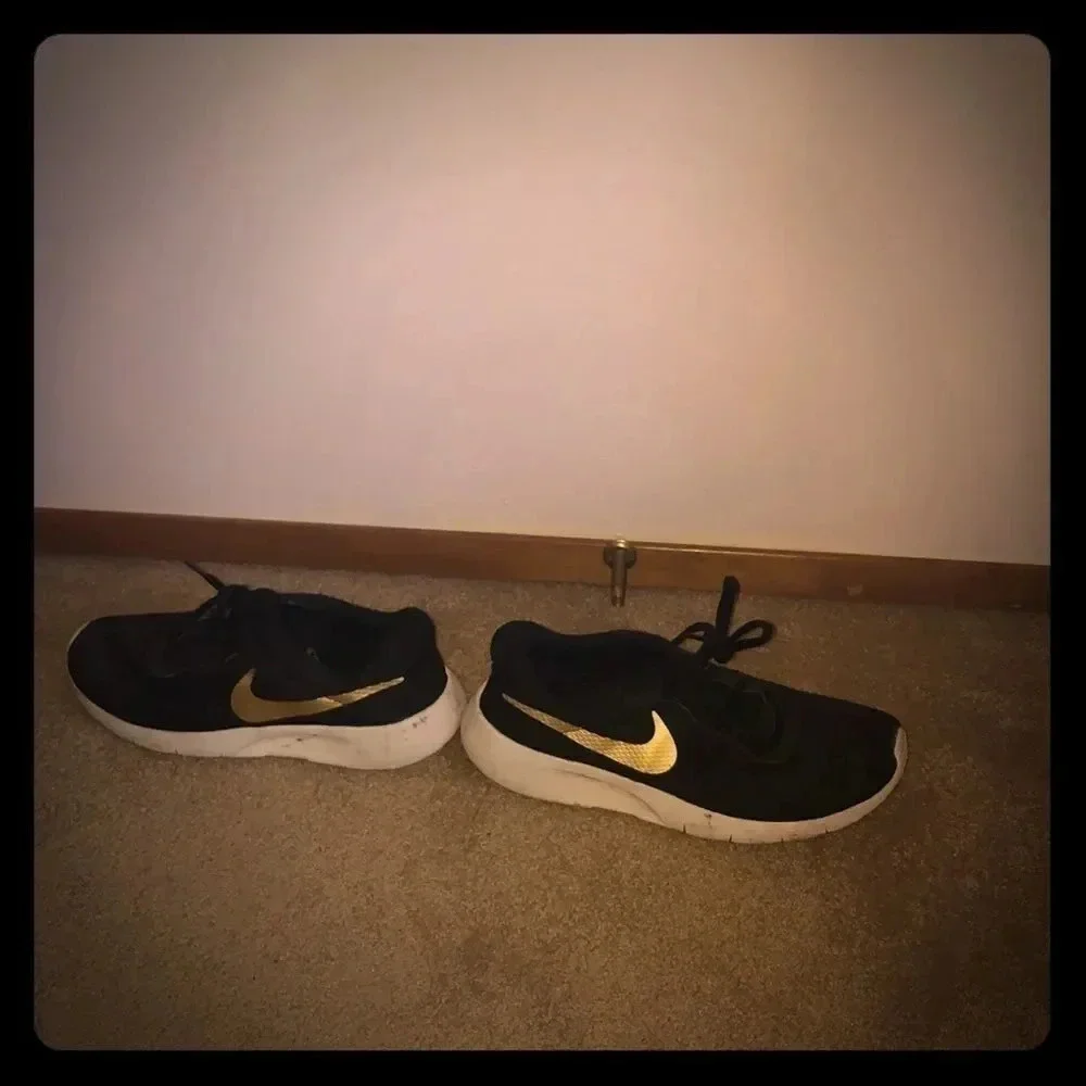 Nike’s with a gold swoosh